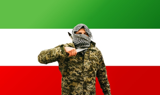 Photo soldier in camouflage uniform on iran flag background. war concept. confrontation problem.