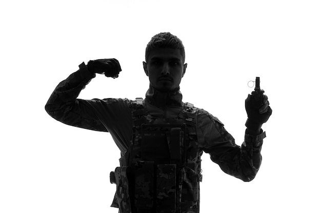 Soldier silhouette army tough handsome serious strong soldier in uniform showing strength