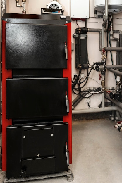 Solid-fuel Boiler with Heating System Equipment in Boiler room. Close up.