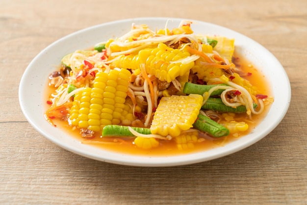 Som Tum Thai spicy papaya salad with corn