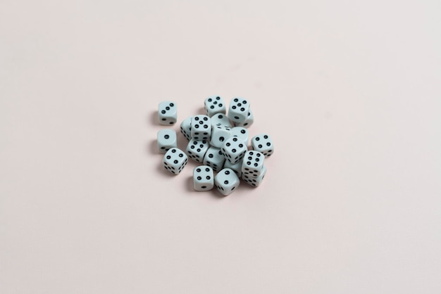 Some dice game cubes with black dots on color surface