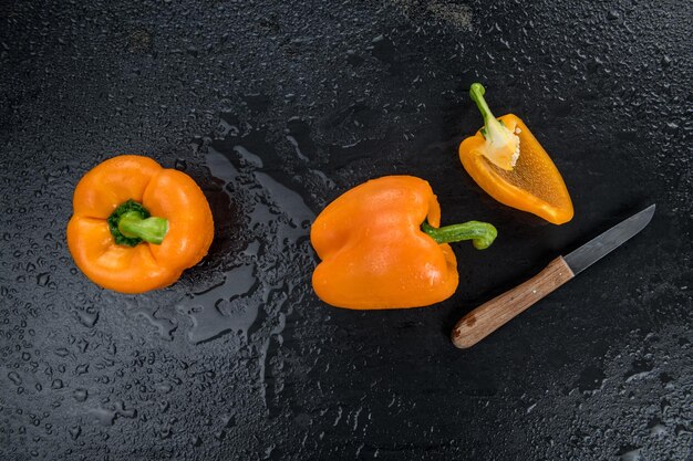 Some fresh made Orange paprika on a vintage slate slab selective focus