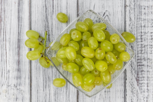 Some fresh White Grapes on wooden background selective focus closeup shot