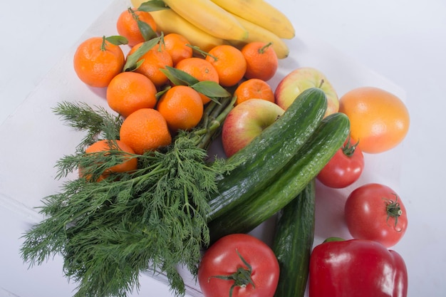 Some fruits and vegetables on white