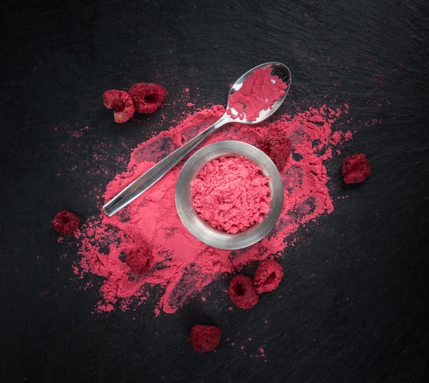 Some Ground Raspberries on a dark slate slab