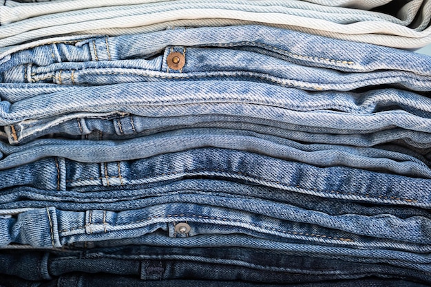 Some stacked blue jeans close up Denim collection