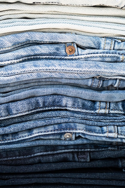 Some stacked blue jeans close up Denim collection