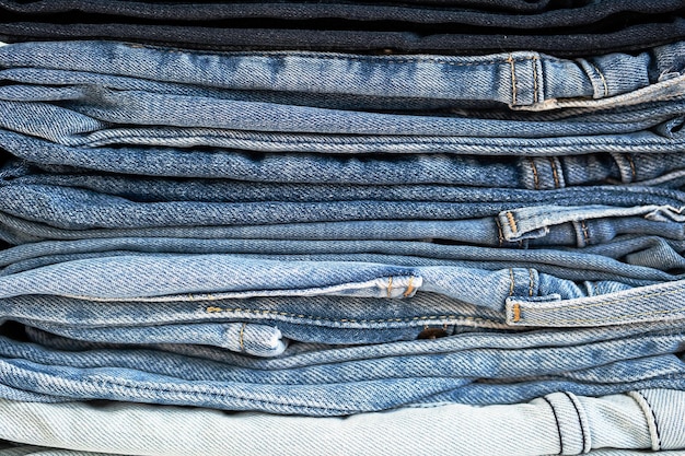 Some stacked blue jeans close up Denim collection