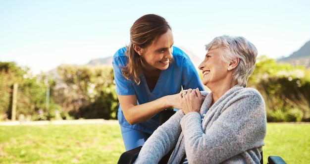 Some vitamin D is just what you need today Cropped shot of a young female nurse outside with a senior patient in a wheelchair