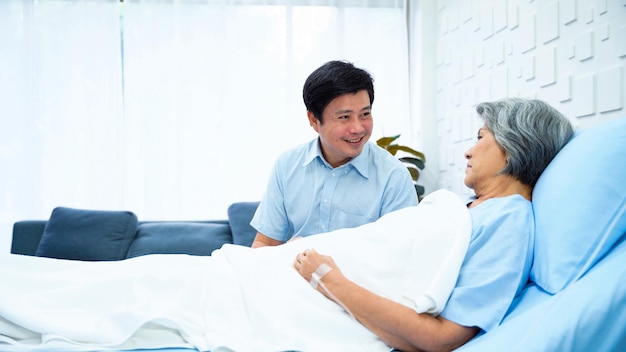 Son of an elderly woman patient encourage his mother be admitted to the hospital