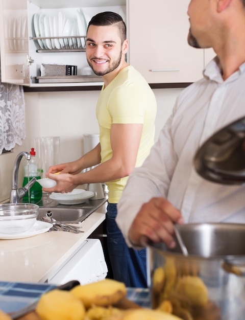 Son helping father to prepare