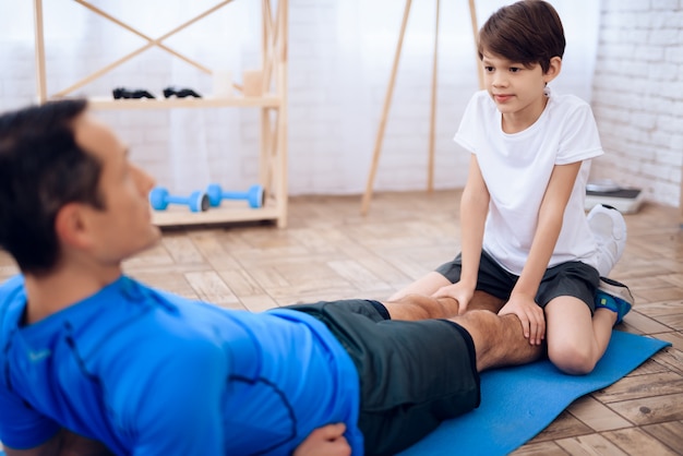 Son holds dad's legs what would he do press.