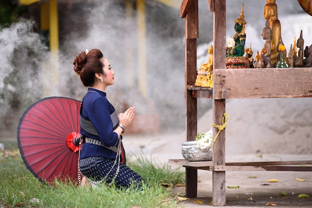 Songkran, Thailand water festival Beautiful woman pour water buddha before Splash