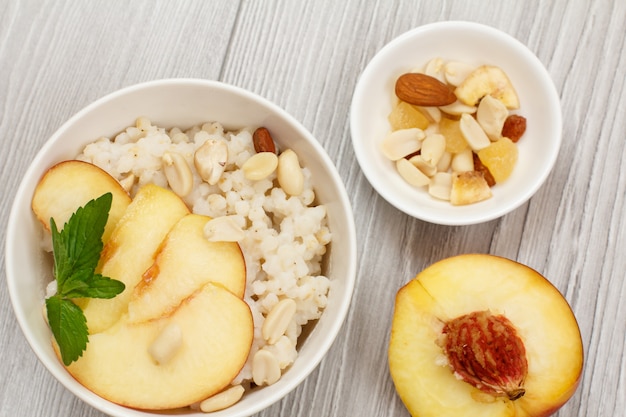 Sorghum porridge with pieces of peach