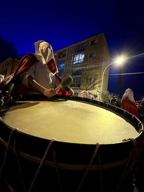 Soria Spain April 11 2022 Holy Monday procession of the Soria brotherhood through the streets at dusk