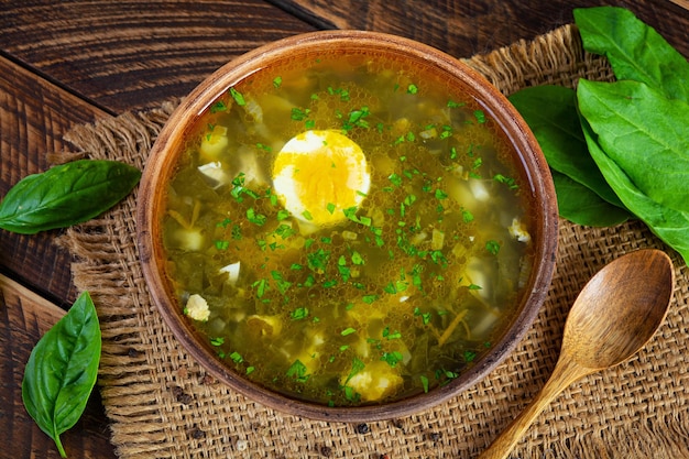 Sorrel soup in bowl Traditional russian green soup with sorrel