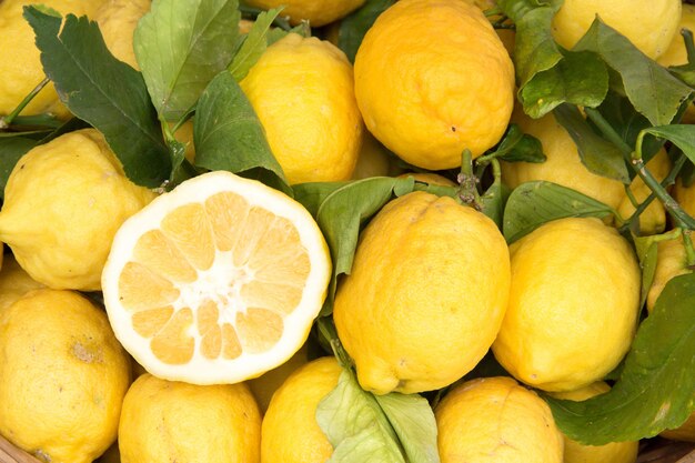 Sorrento lemons on the local market with one half lemon close up