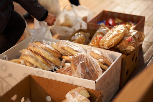 Sorting fresh bread in boxes humanitarian food aid