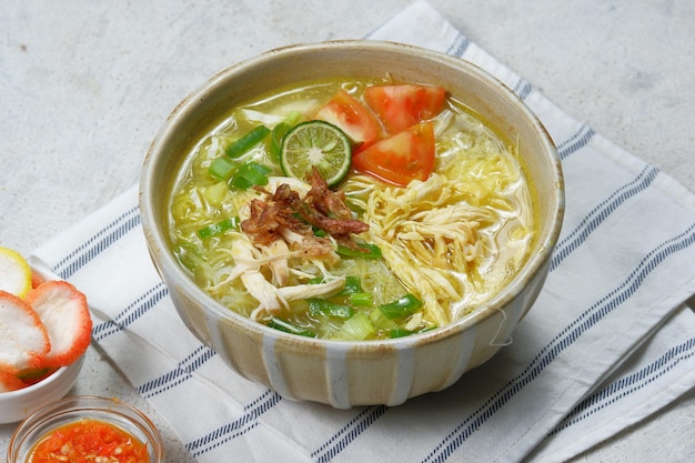 soto ayam is a typical indonesian food in the form of a kind of chicken soup with a yellowish sauce