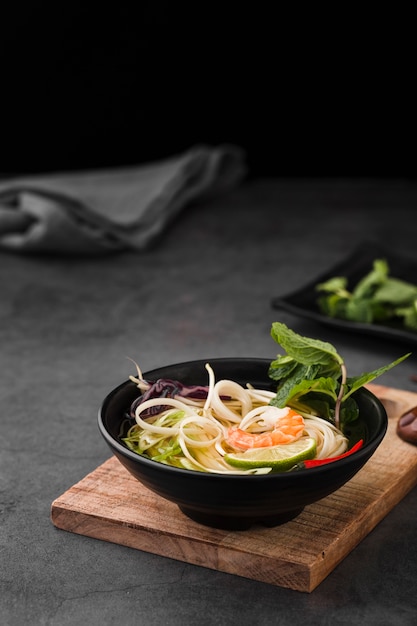 Soup bowl with noodles and mint