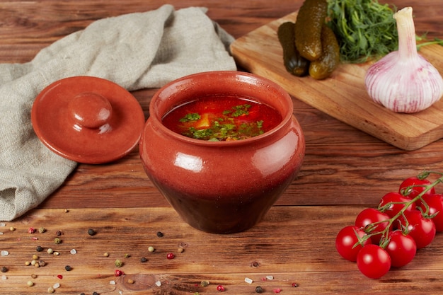 Soup Kharcho with beef meat on wood background