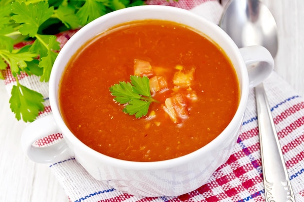 Soup tomato with pieces on the light board