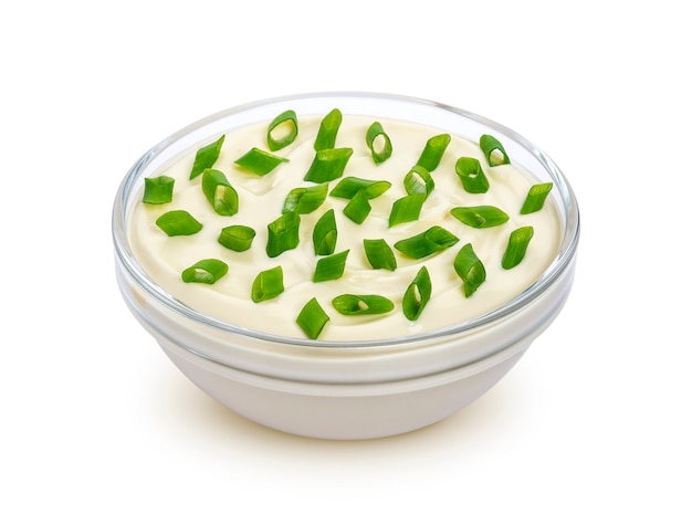 Sour cream and green onion isolated on white background