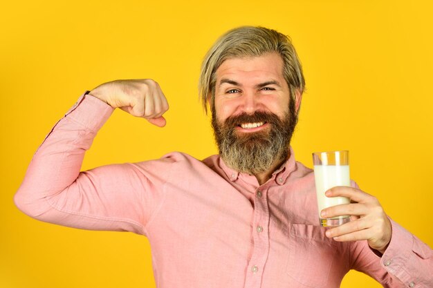 Source of calcium. Almond milk is rich in several healthy nutrients. Milk for good health. Lactose free. Bearded man hold glass of milk. Vegan milk concept. Drink protein cocktail. Healthy habits.