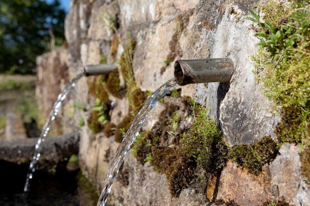 Source of two pipes with clear water 