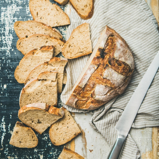 Sourdough wheat bread loaf cut in slices square crop