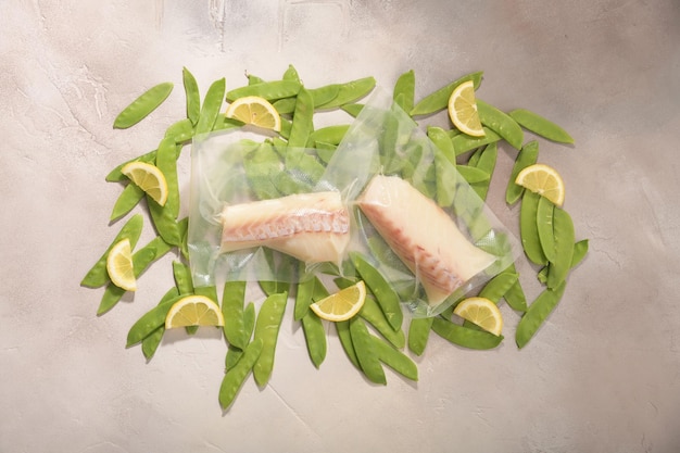 Sous Vide cooking concept Vacuum packed ingredients arranged on light background