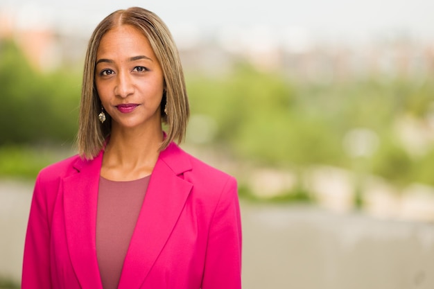 South african businesswoman ceo headshot in blurry background millennial woman entrepreneur