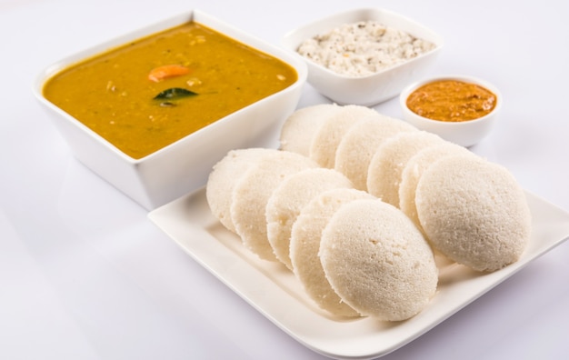 South Indian breakfast recipe Idly or Idli or rice cake served with coconut chutney and sambar, selective focus