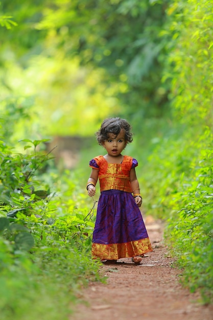 South Indian cute girl kid wearing  beautiful traditional dress long skirt and blouse