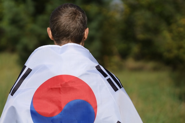 South Korea flag on human shoulders