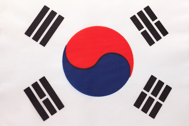 South Korea national fabric flag, textile background. Symbol of international asian world country.