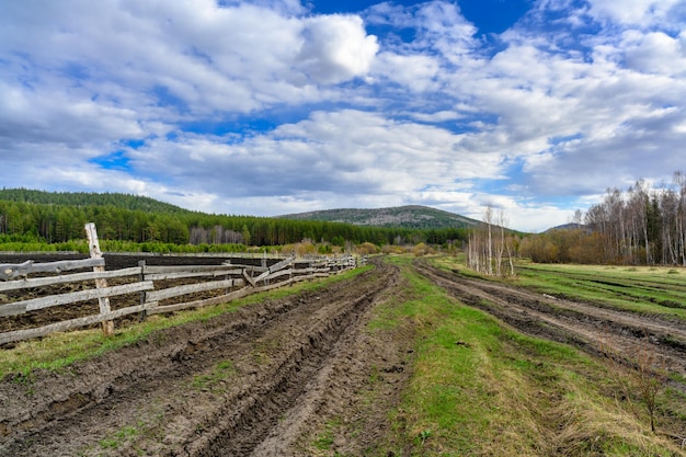 South Ural farm wooden fence and arable land with a unique landscape vegetation and diversity of nature