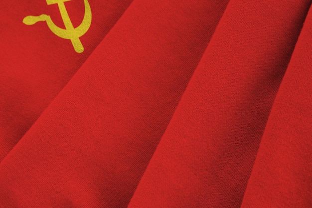 Soviet Union flag with big folds waving close up under the studio light indoors The official symbols and colors in banner