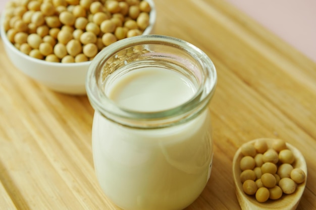 Soy milk pouring in a glass jar