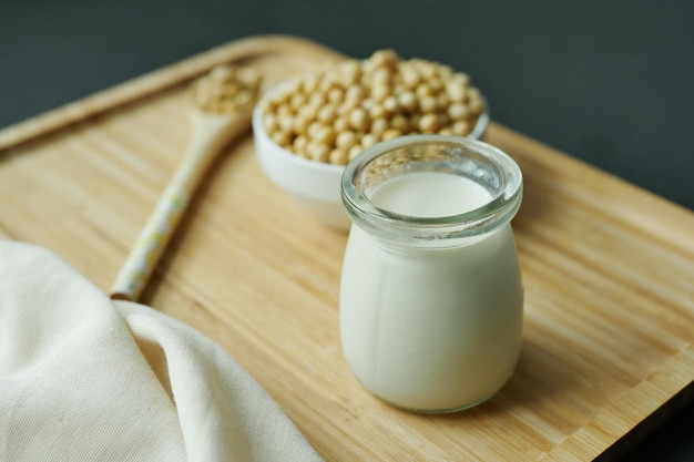 Soy milk pouring in a glass jar