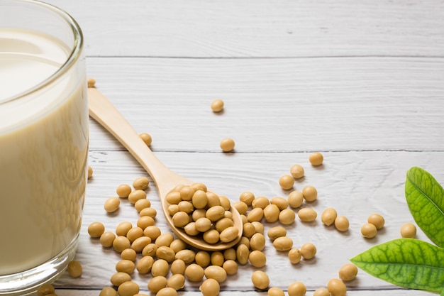 Soy milk and soy bean it on white table background, healthy concept. Benefits of Soy.