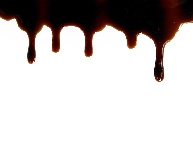 Soy sauce on white background Spilled soy sauce sauce puddle Texture of spilled soy sauce