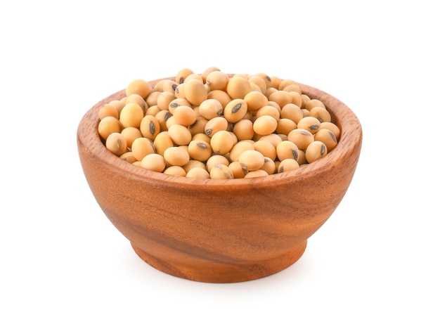 Soybeans in wooden bowl on white background