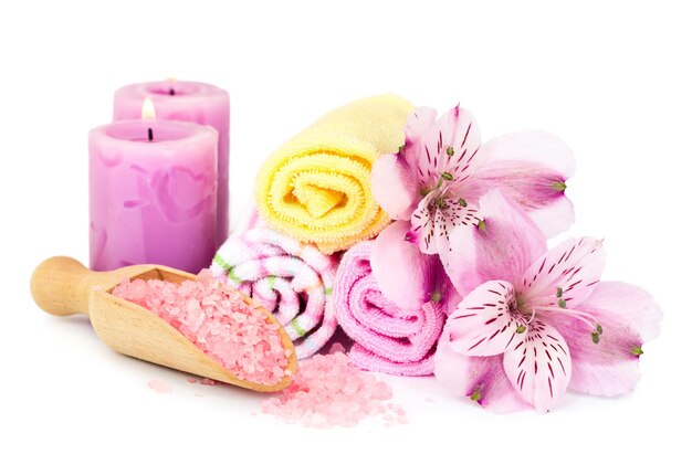 Photo spa background flowers towels candles and sea salt