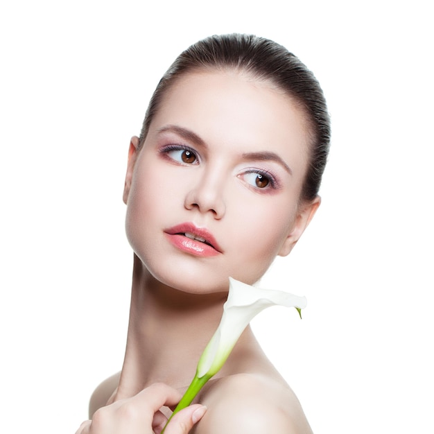 Spa Beauty Portrait of Perfect Woman. Beautiful Face, Fresh Skin and Lily Flower Isolated