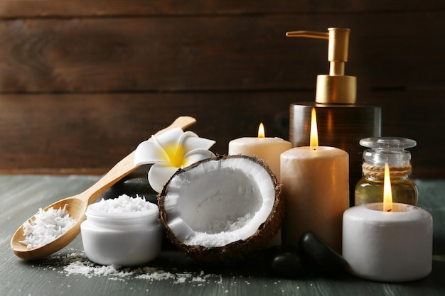 Spa coconut products on dark wooden background