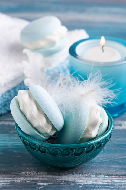 Spa composition with bath bomb macaroon and dry flowers on rustic background in monochrome style. Candles and salt. Beauty treatment and relax