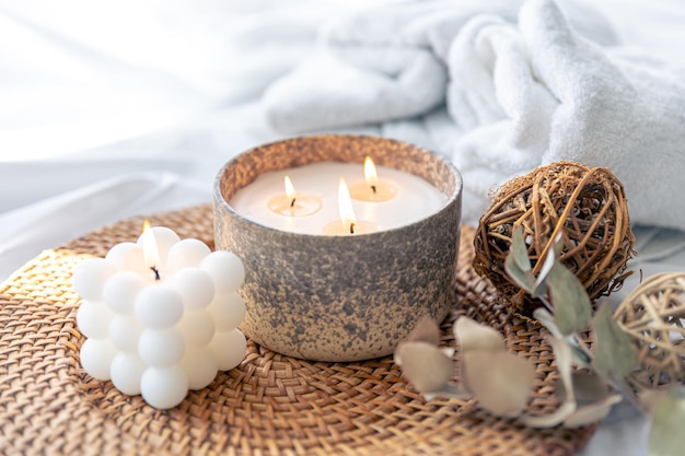 Spa composition with candles on a blurred background