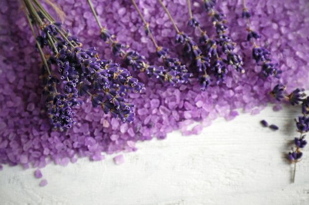 Spa composition with lavender and salt on white wooden background