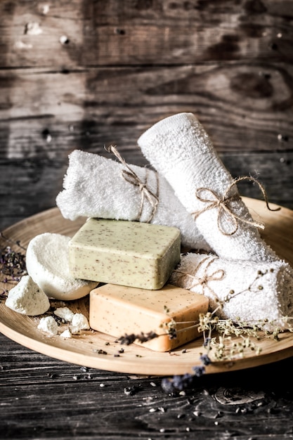 Spa composition with soap wooden background,